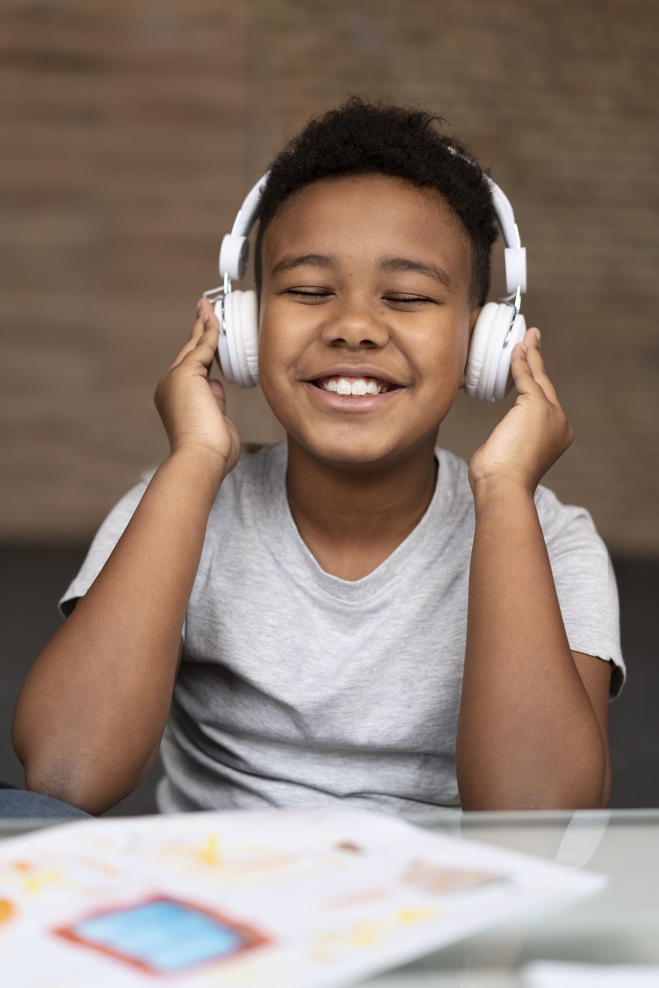medium shot kid wearing headphones