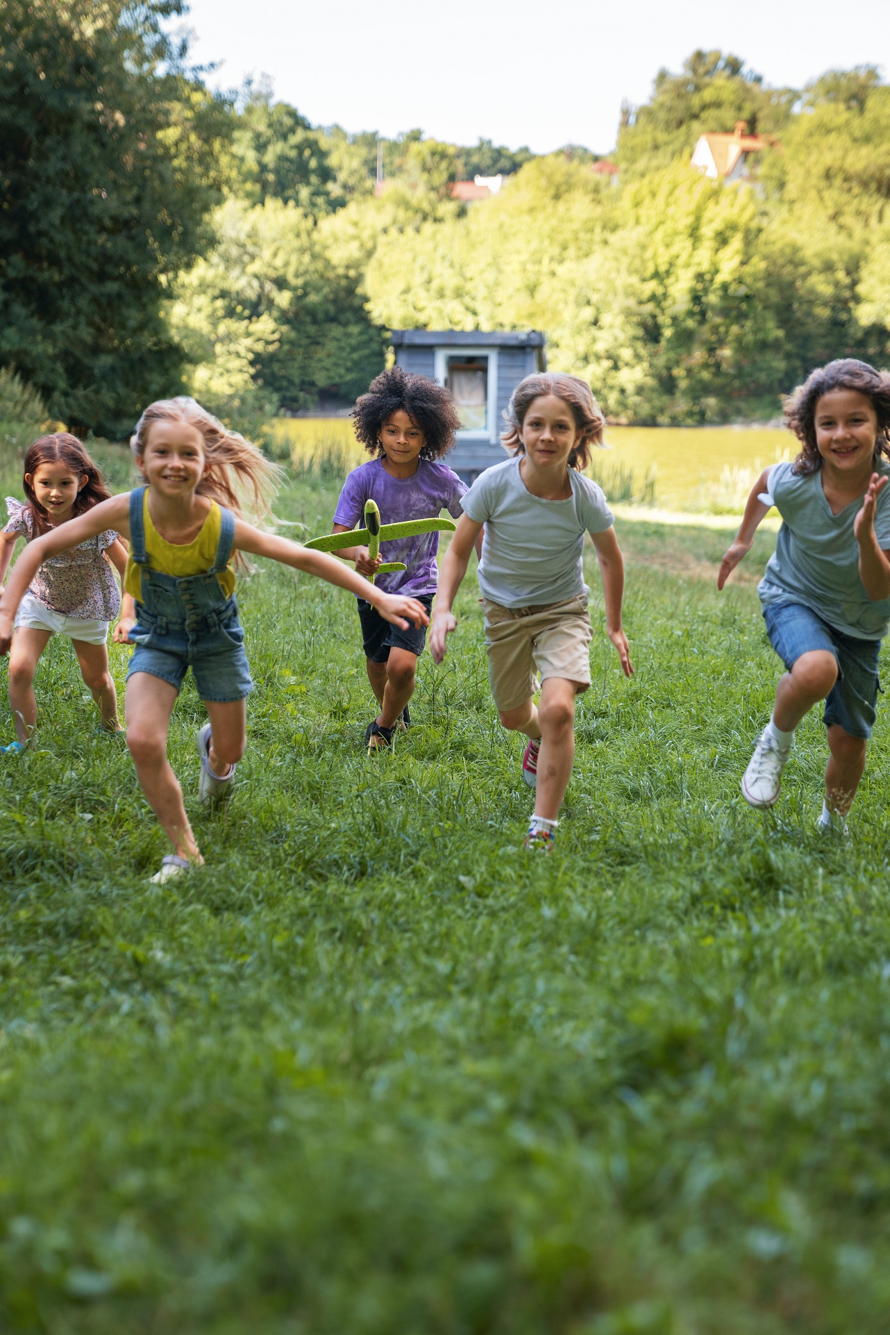 full shot kids running outdoors