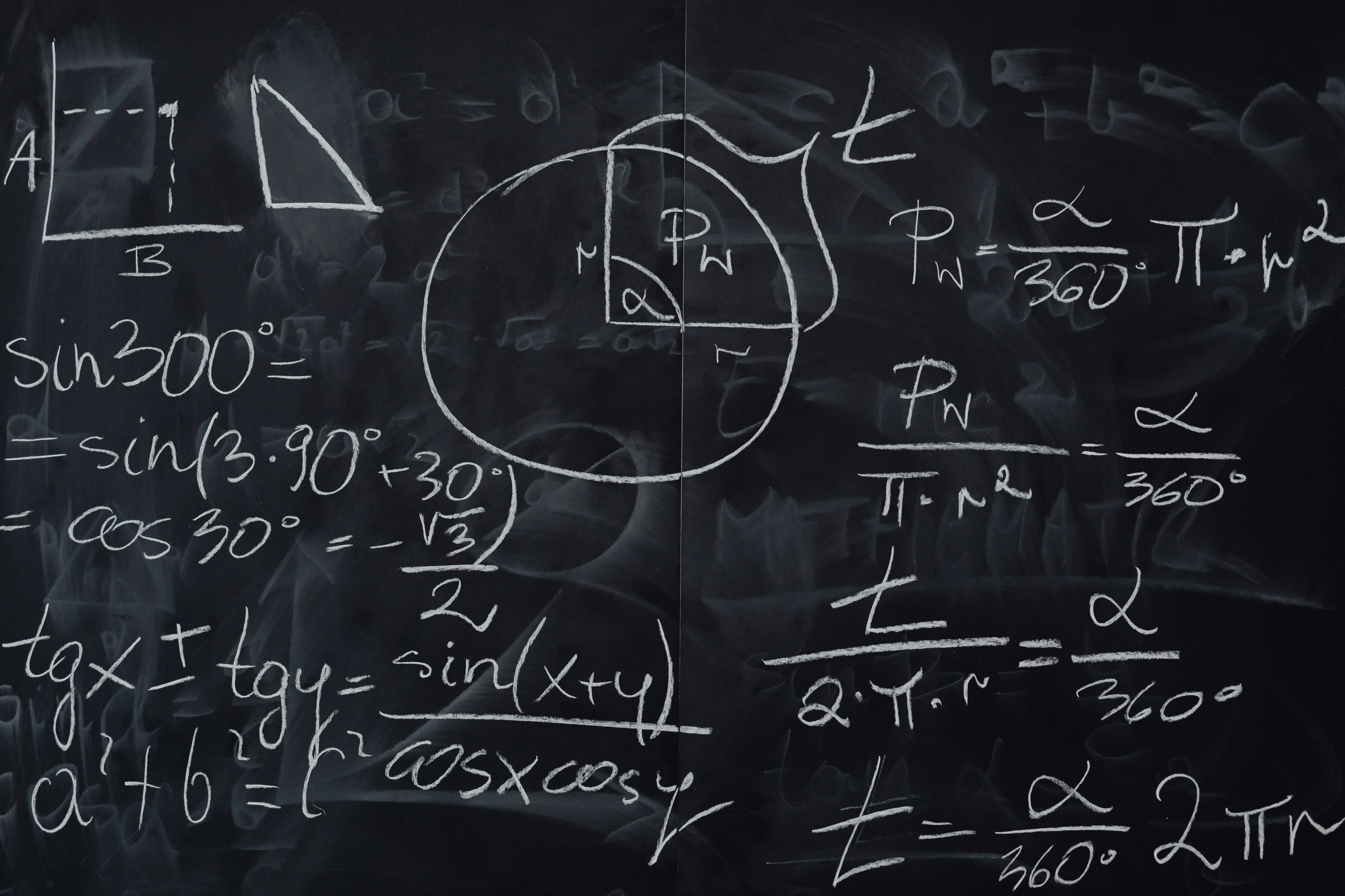 Mathematical calculations on a chalkboard