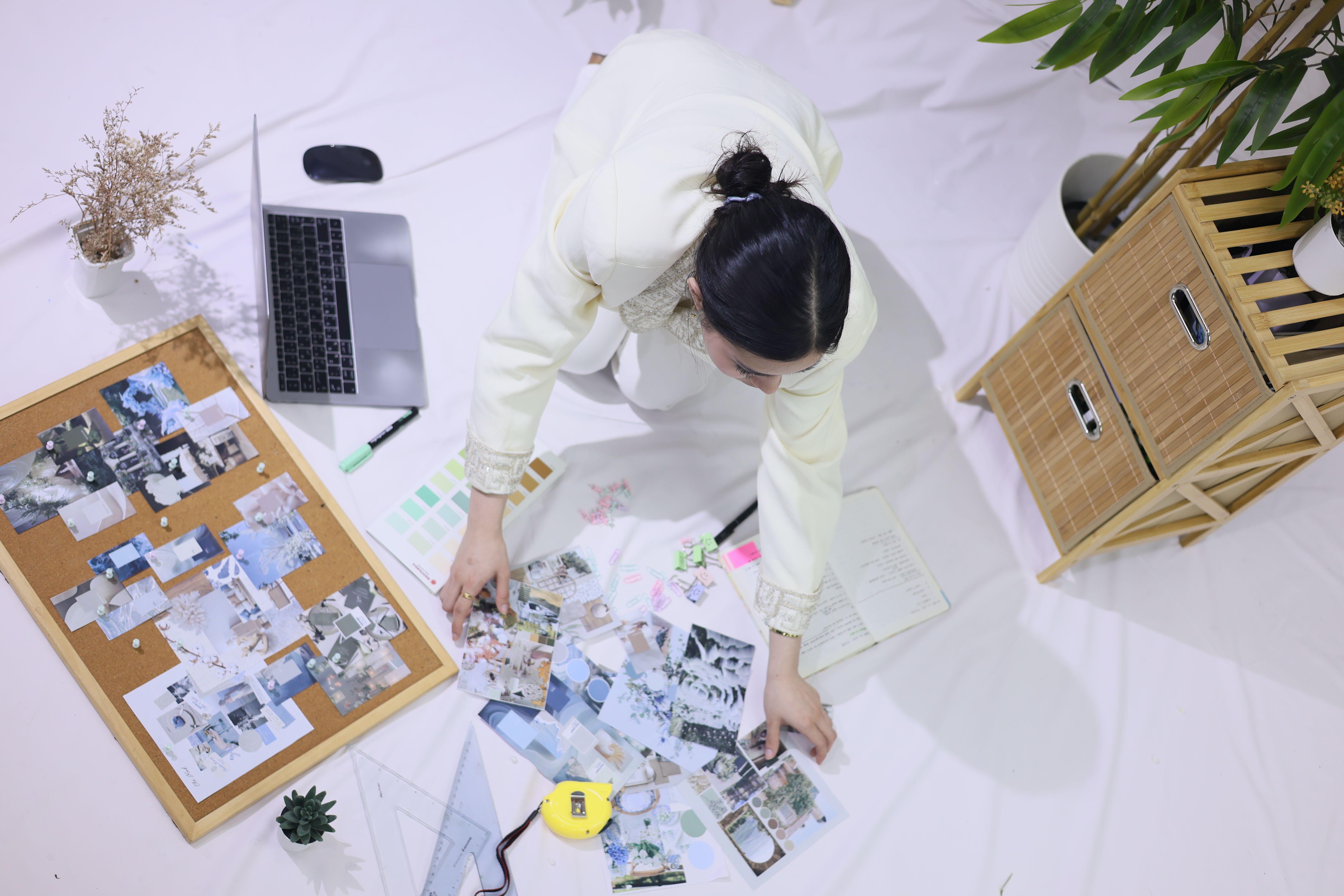 Web design mood board and laptop workspace